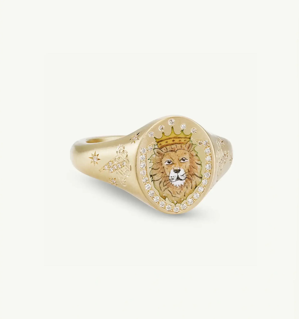 Gold ring featuring an intricately detailed lion motif with a crown, surrounded by diamonds and engraved designs.