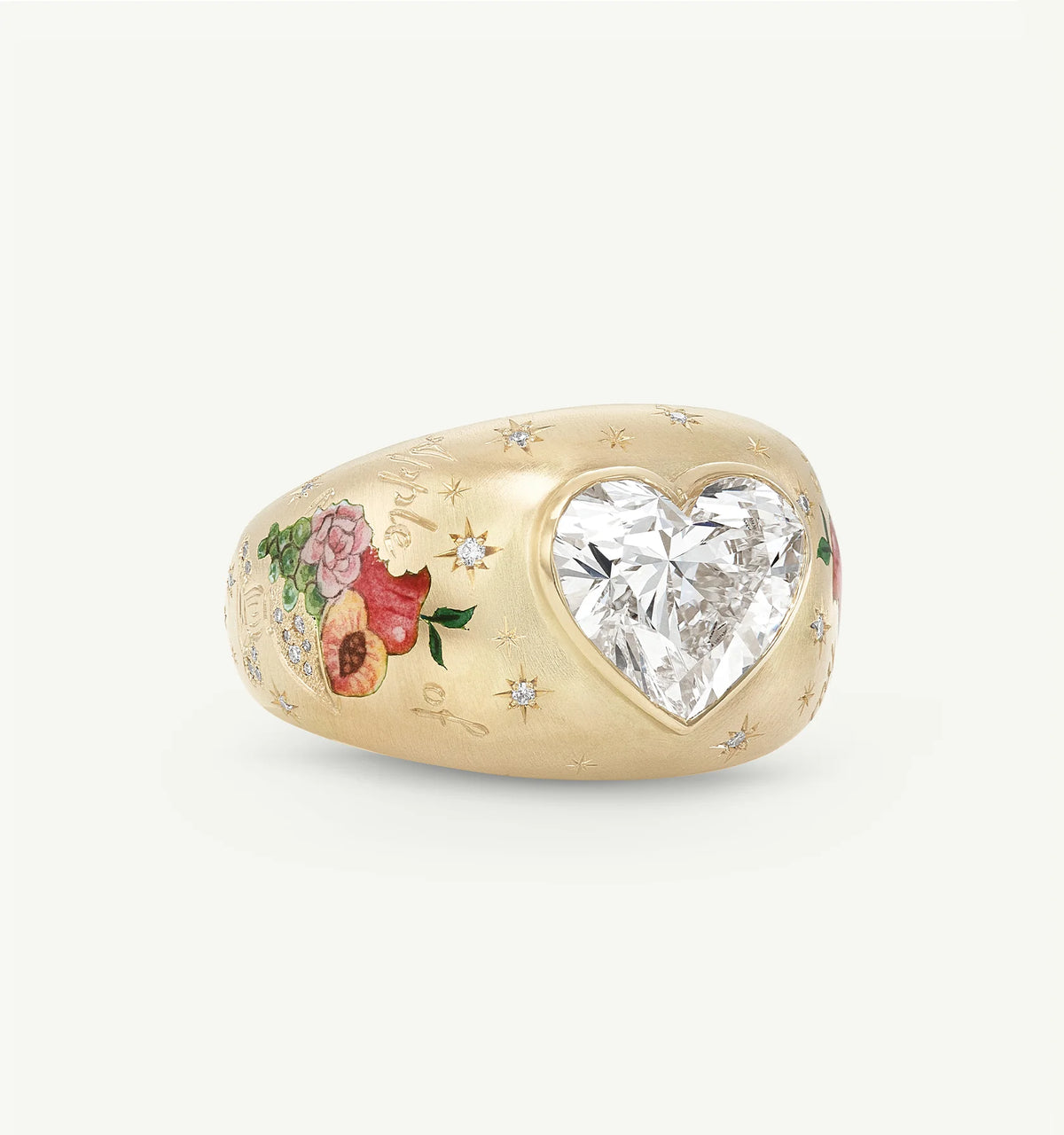Gold ring featuring a heart-shaped diamond and floral enamel engravings.