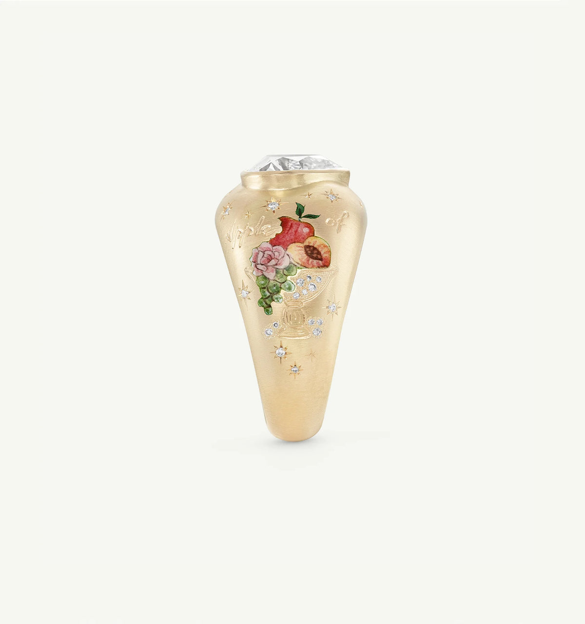Gold ring featuring enamel floral motifs and a diamond at the top.