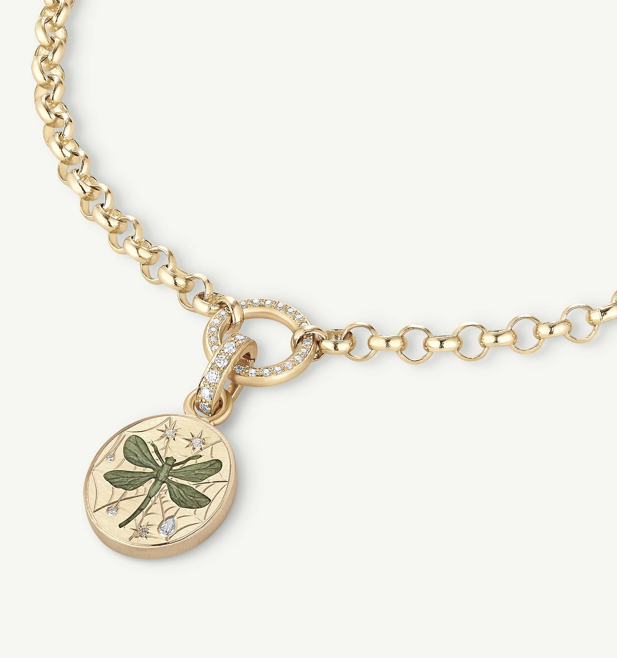 Gold necklace featuring a dragonfly pendant with engraved details and diamonds.