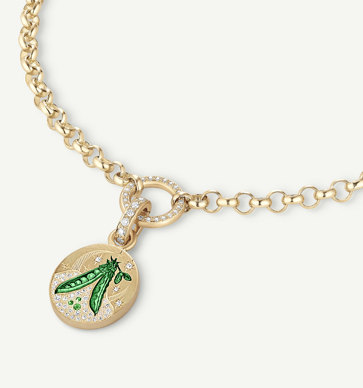 Gold necklace with an engraved pea pod pendant featuring green enamel and small diamonds on the chain.