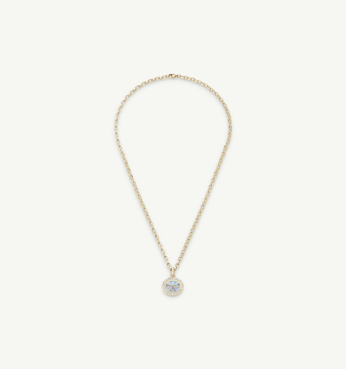 Gold necklace with a round pendant featuring a blue topaz surrounded by smaller diamonds.