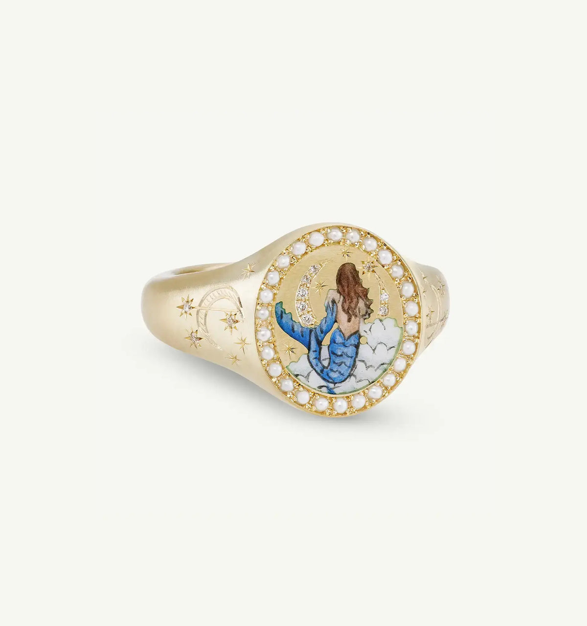Gold ring featuring a hand-painted mermaid design surrounded by pearls and star motifs.