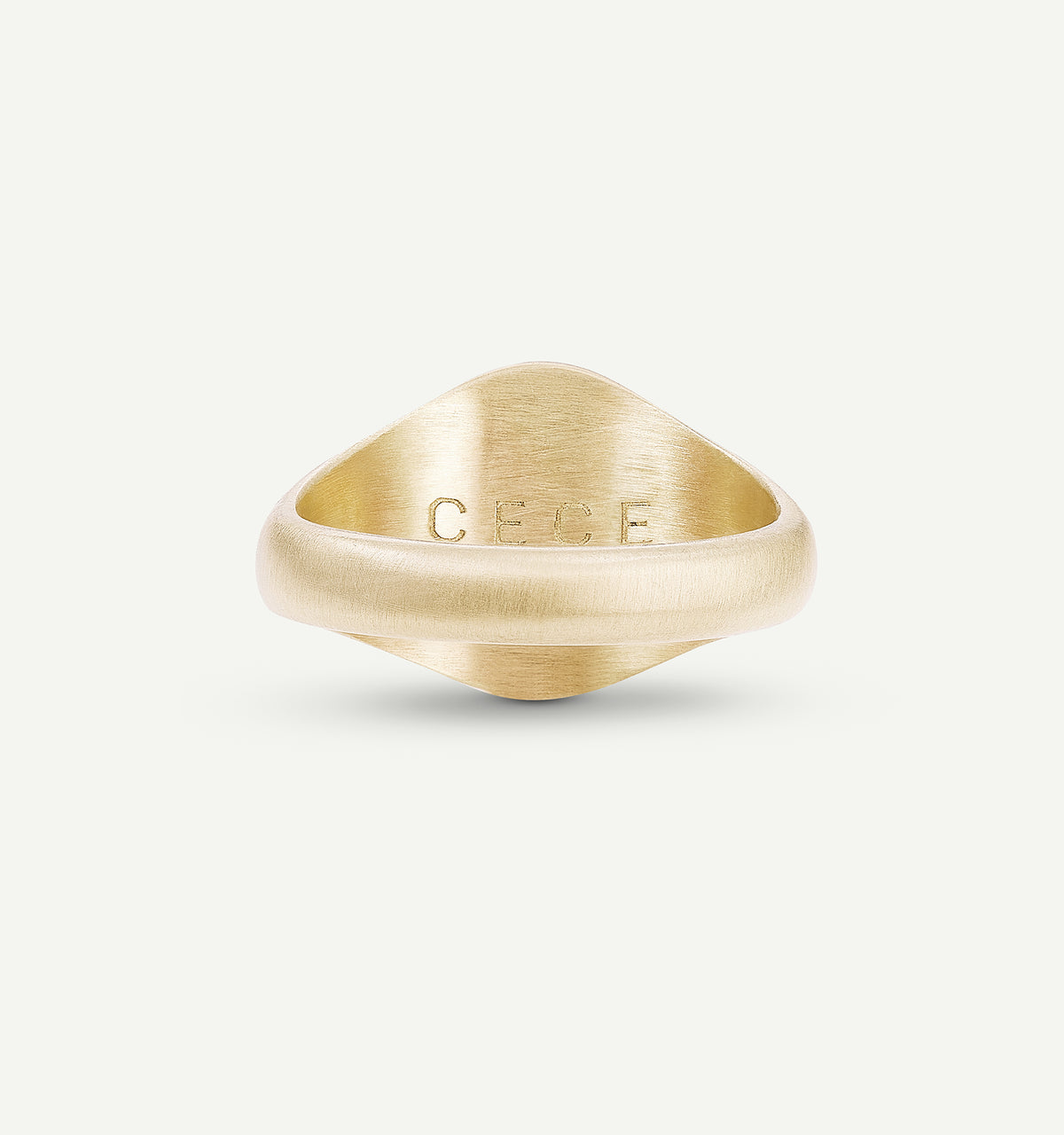 Gold signet ring featuring a brushed finish and engraved lettering "CECE."
