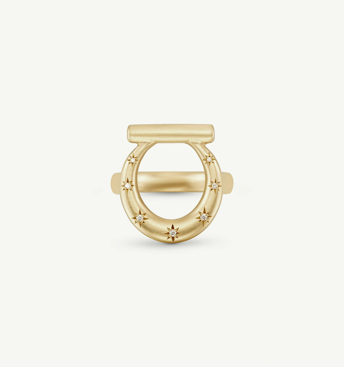 Gold ring featuring a smooth band and star-shaped diamond accents.