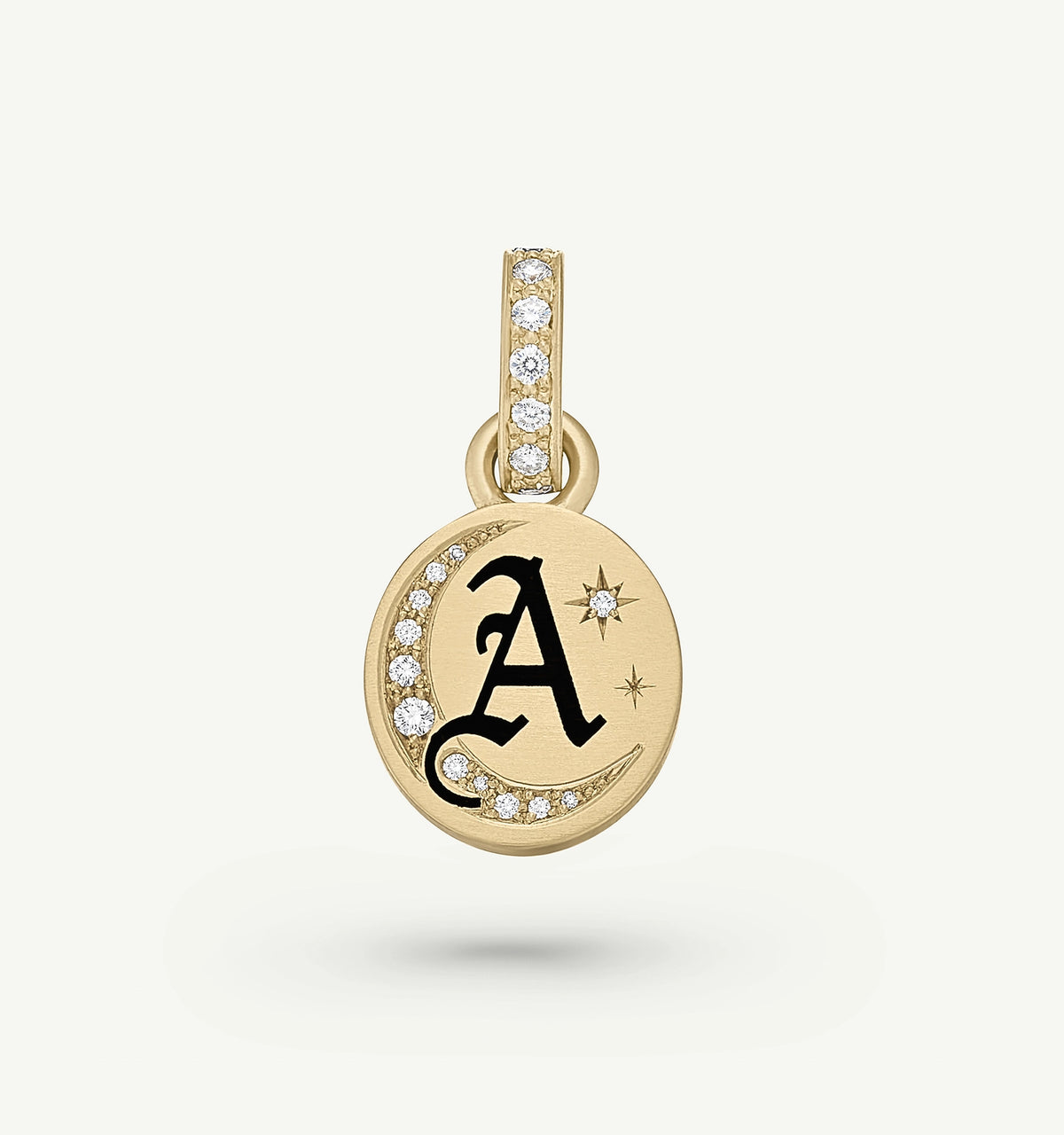 Gold pendant featuring a black letter "A" with diamond accents and a crescent moon design.