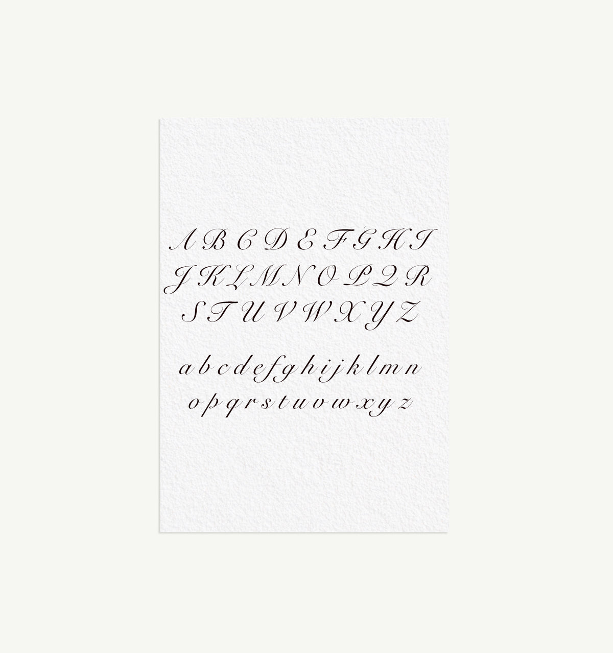 Alphabetic calligraphy design on textured white paper.