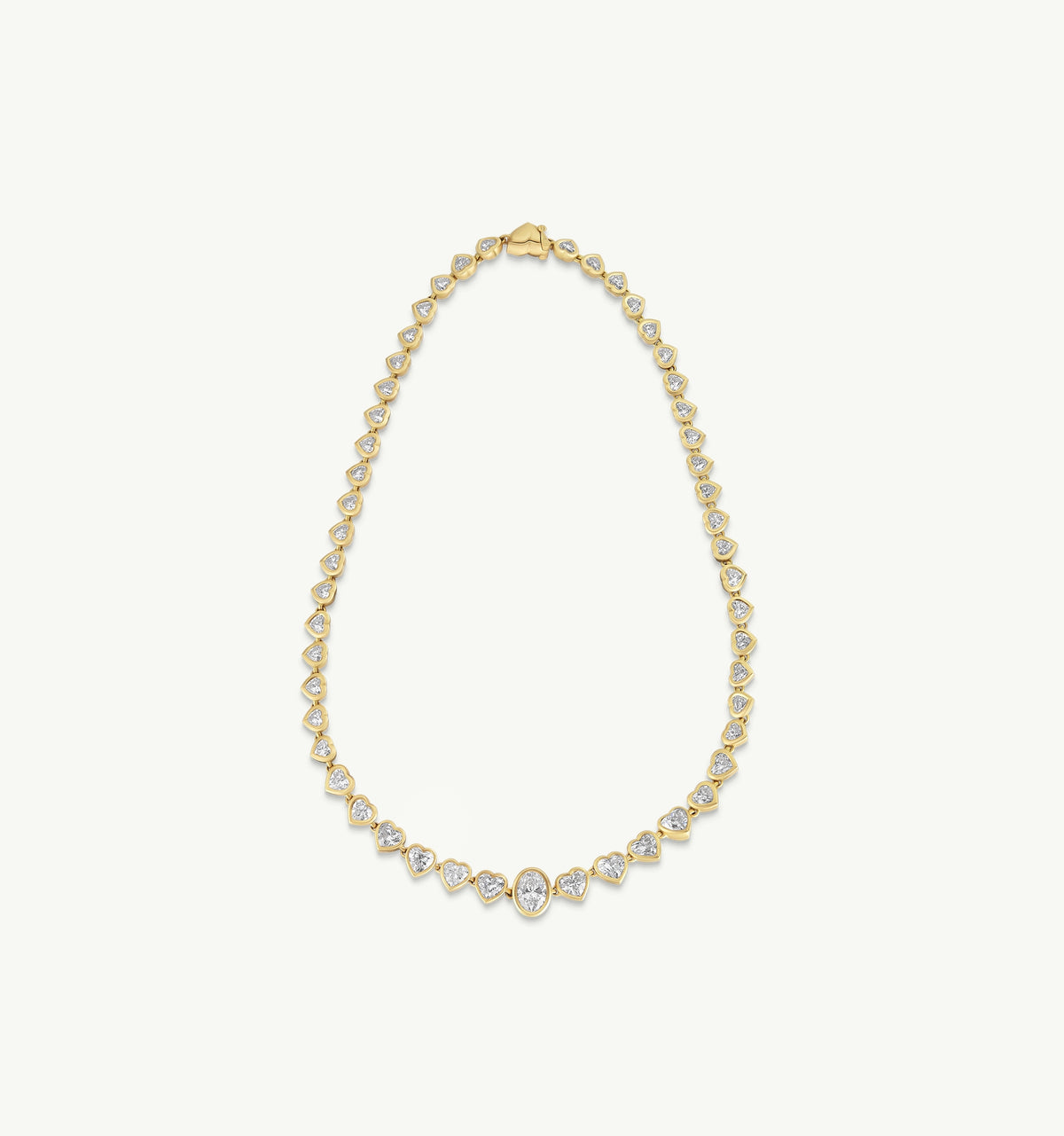 Gold necklace featuring pear-shaped and round cut diamonds set in a delicate design.