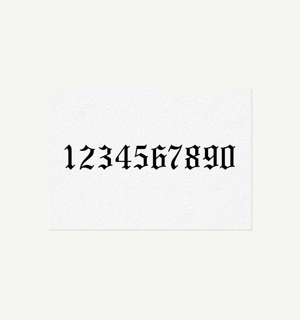 A white card featuring bold black numbers 1 to 9 and 0 in a decorative font.