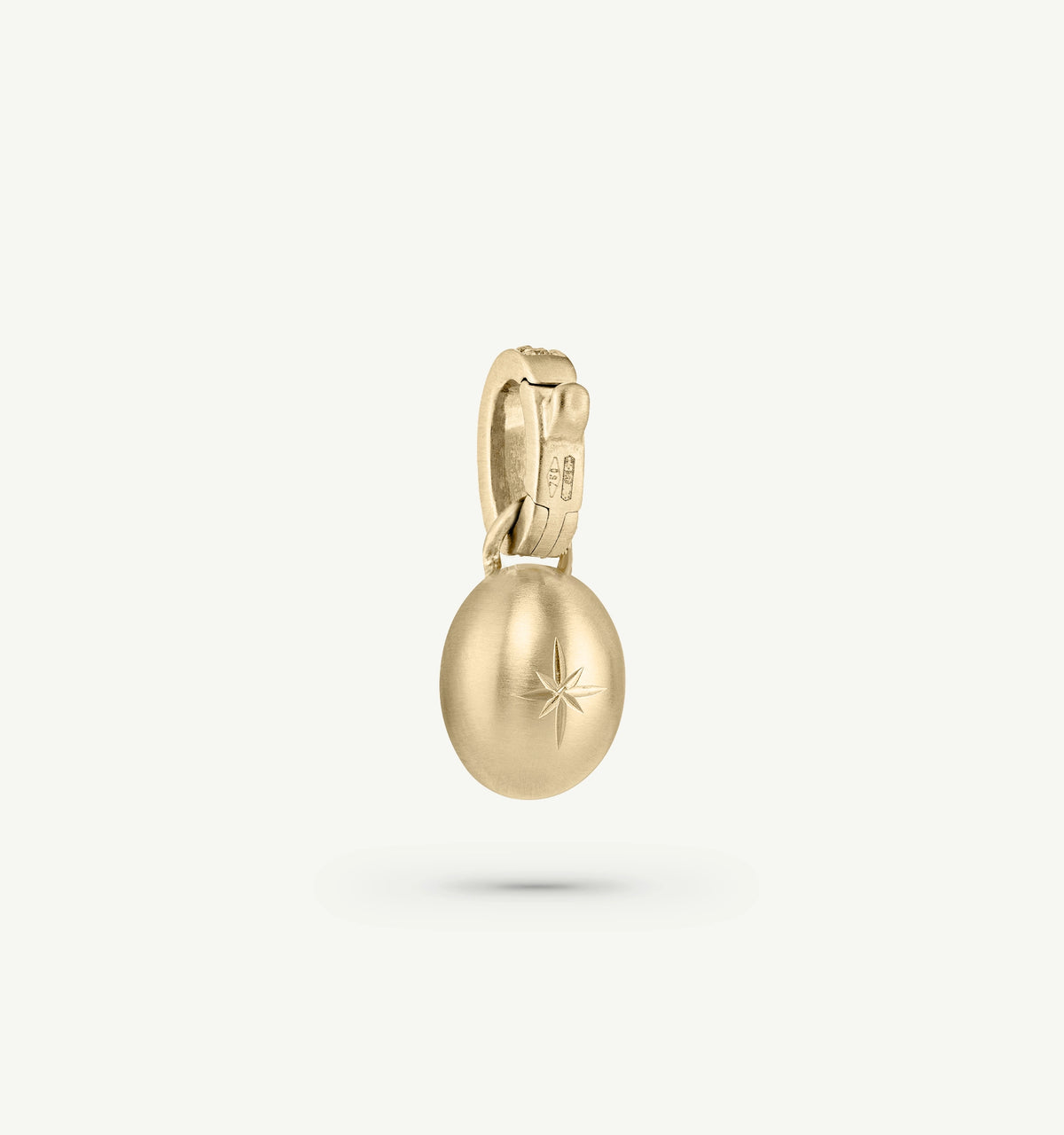 Gold pendant featuring a star motif with a matte finish.