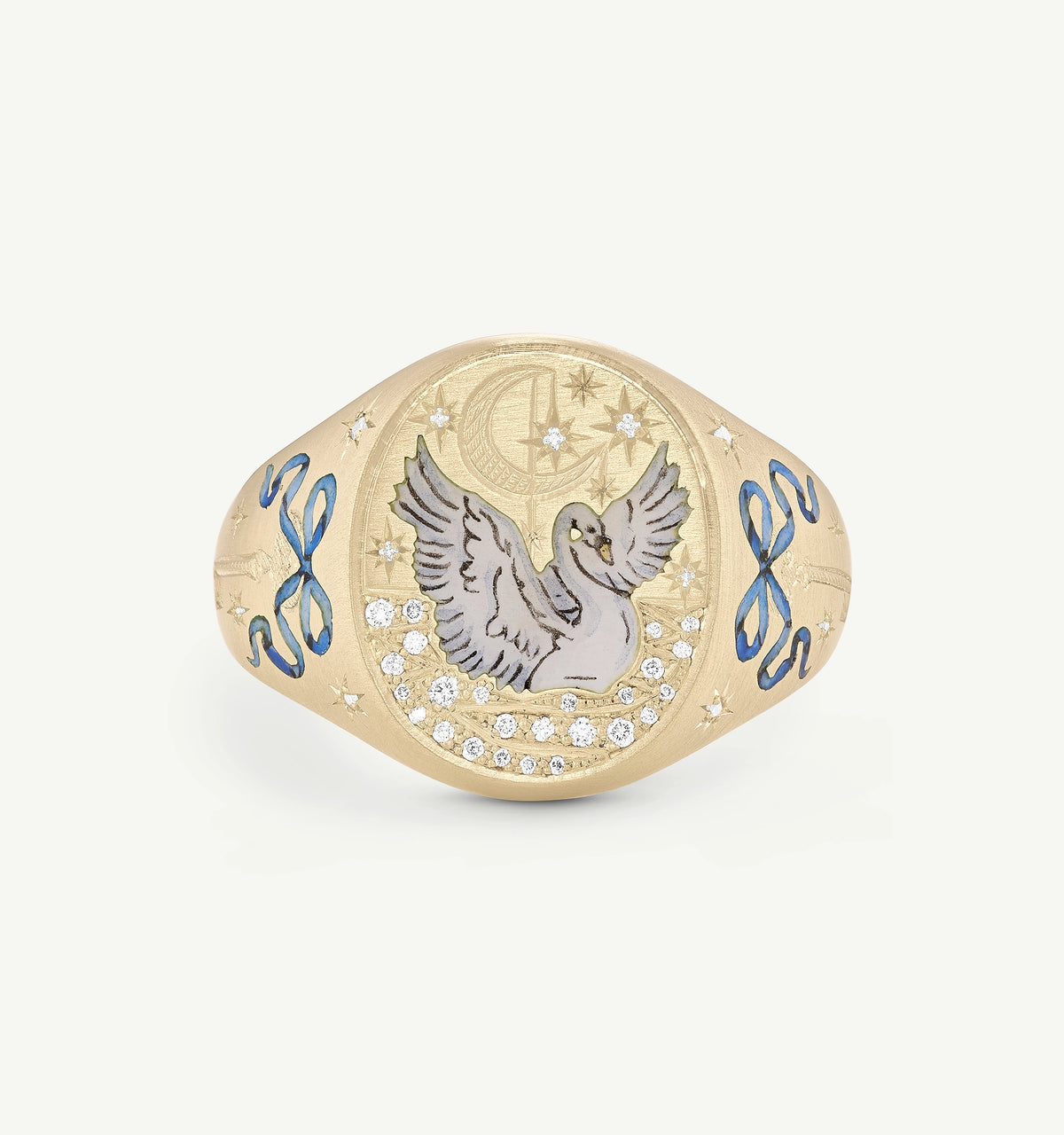 Gold ring featuring an engraved swan design and blue accents with diamonds in a celestial motif.