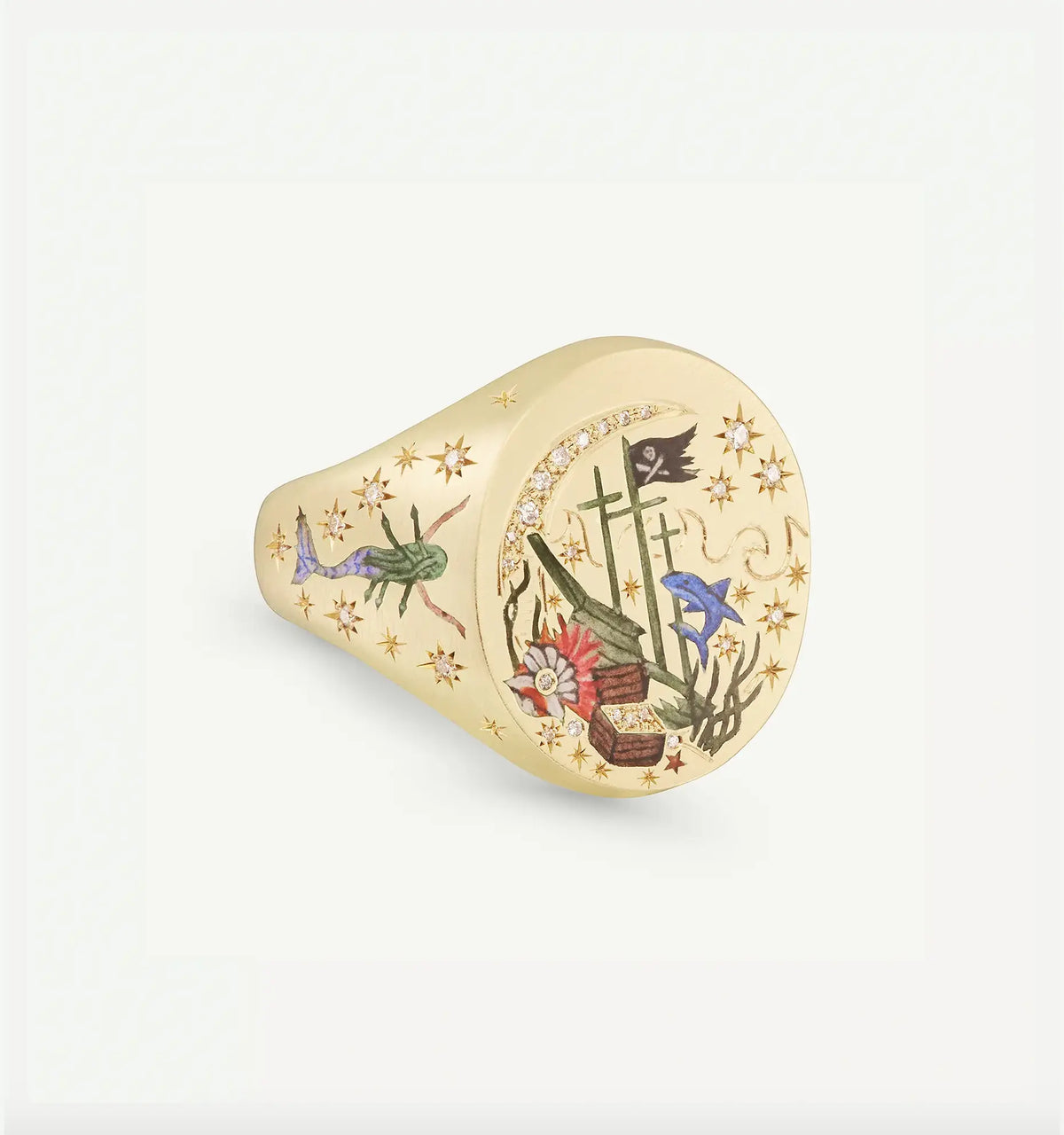 Gold ring featuring intricate enamel designs, including a pirate flag, flowers, and star motifs.