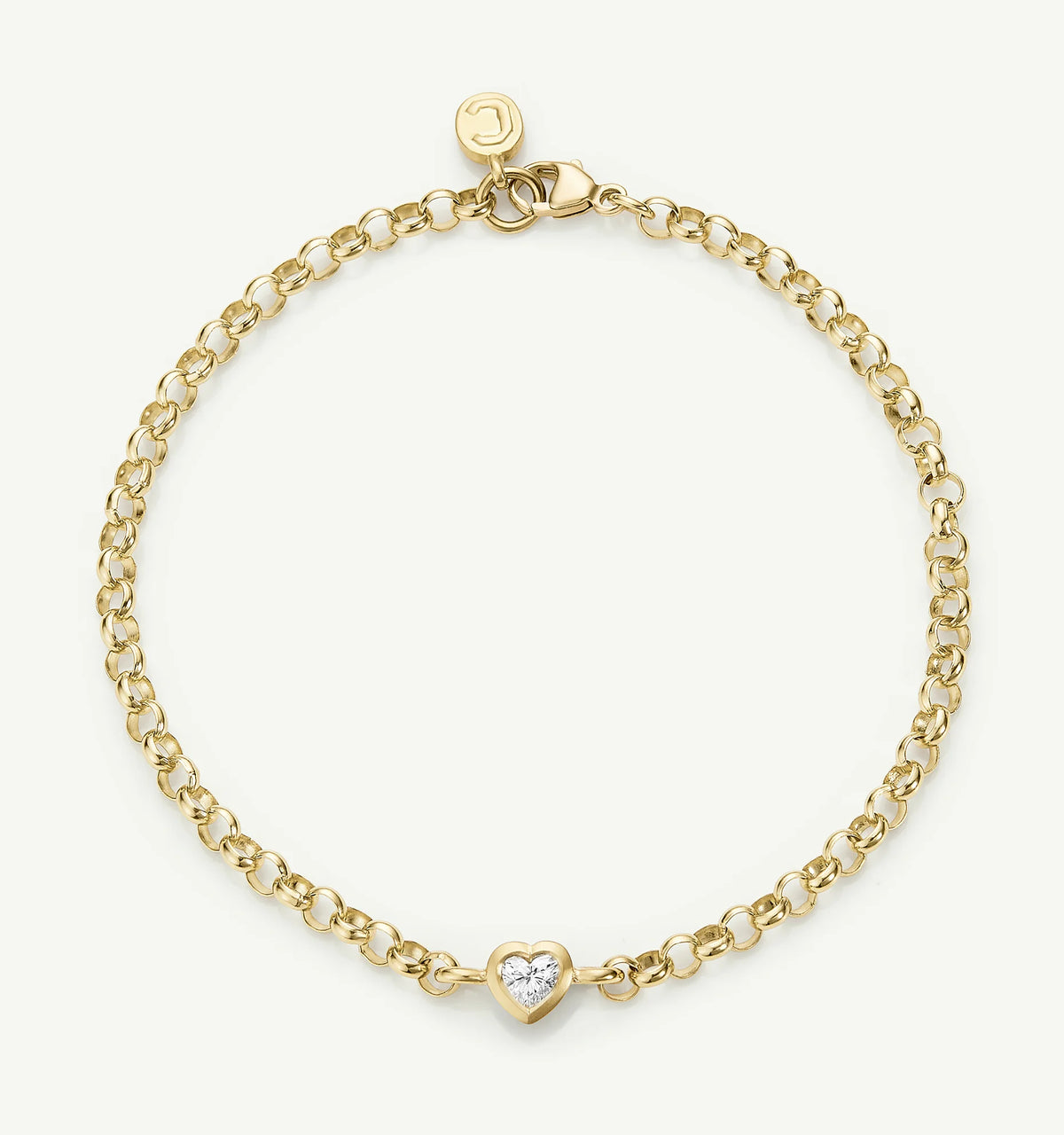 Gold bracelet featuring a heart-shaped charm set with a diamond.
