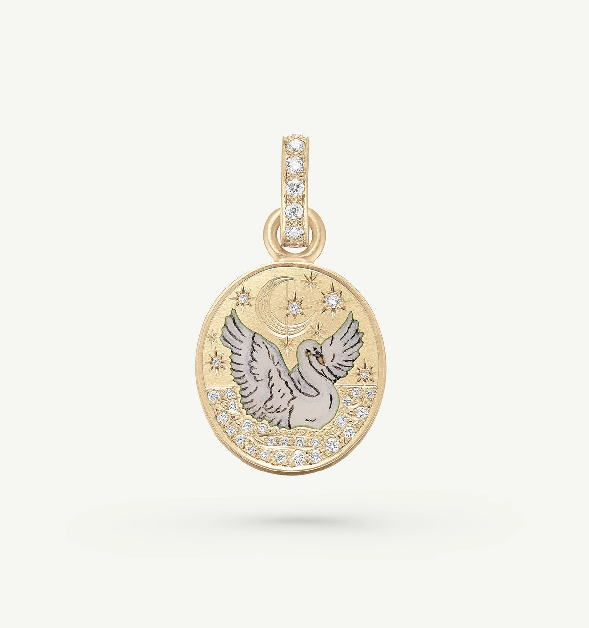 Gold pendant featuring a dove with enamel detailing and diamond accents, set against a celestial background.