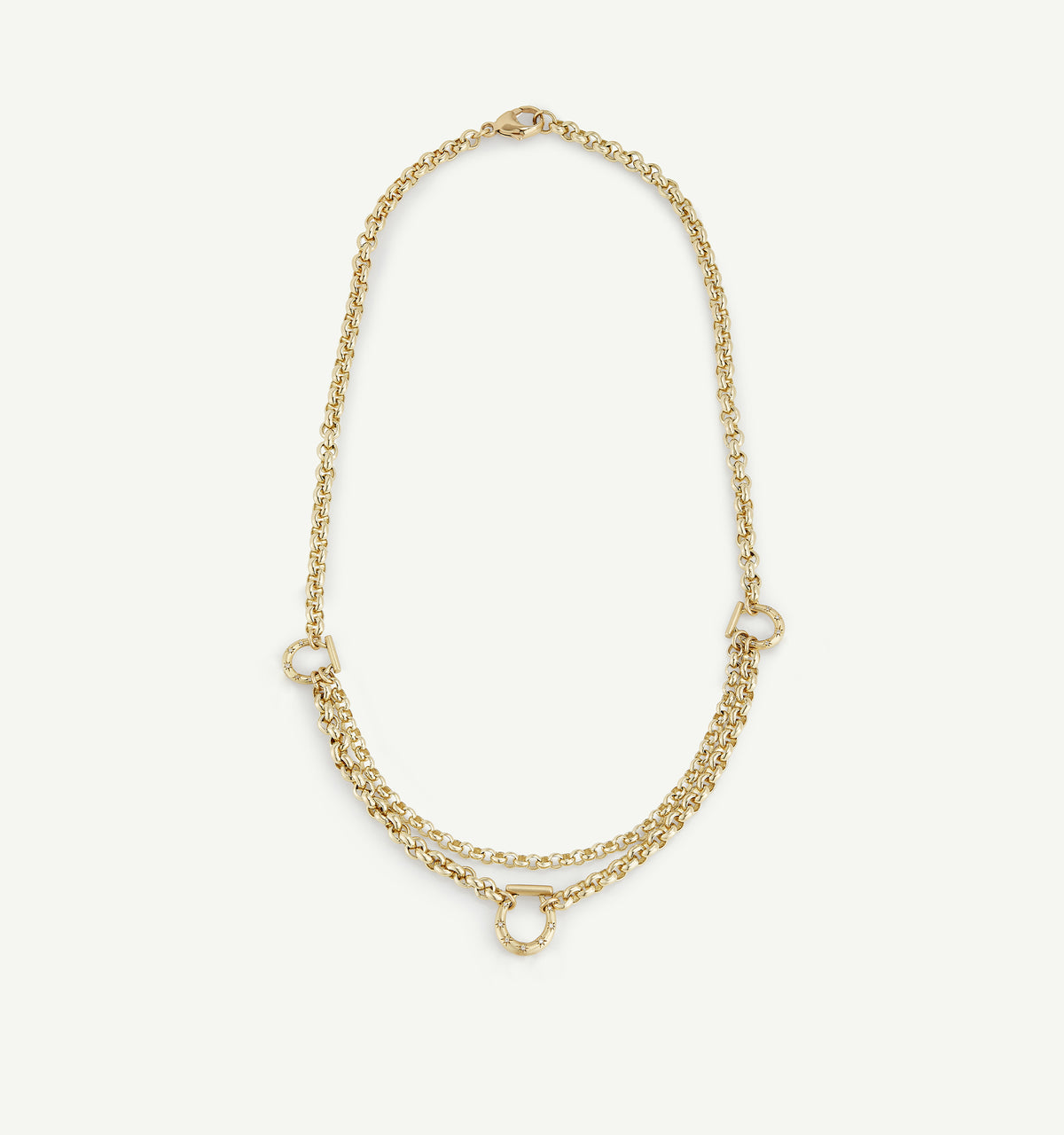 Gold layered necklace featuring interlocking circular accents on a fine chain.