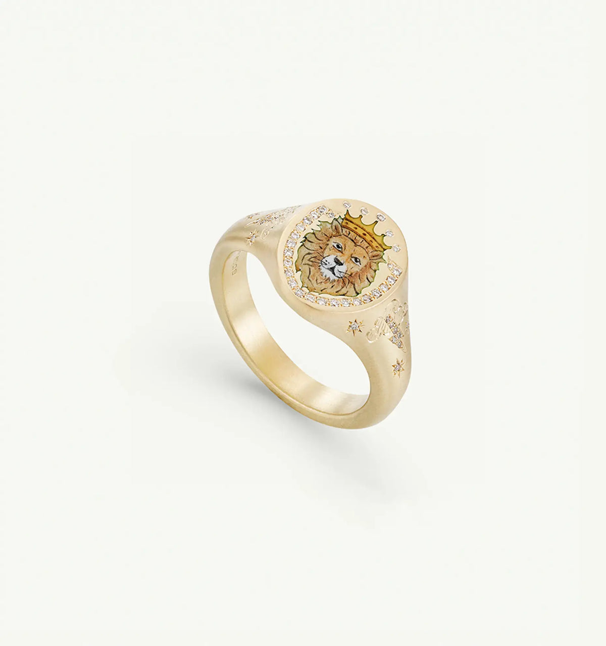 Gold signet ring featuring a lion motif in enamel and star engravings.