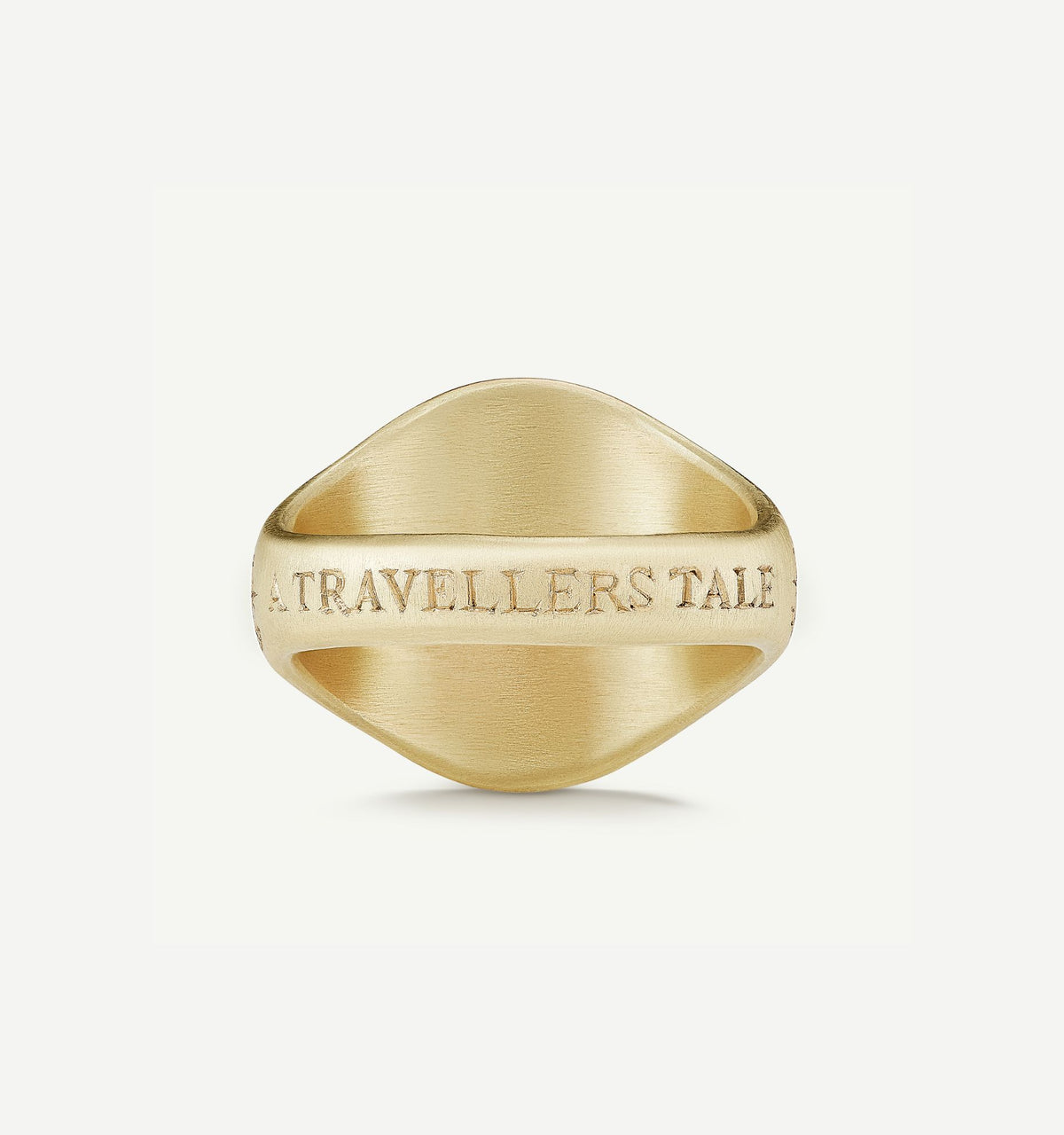 Gold signet ring with an engraved inscription reading "A TRAVELLERS' TALE."
