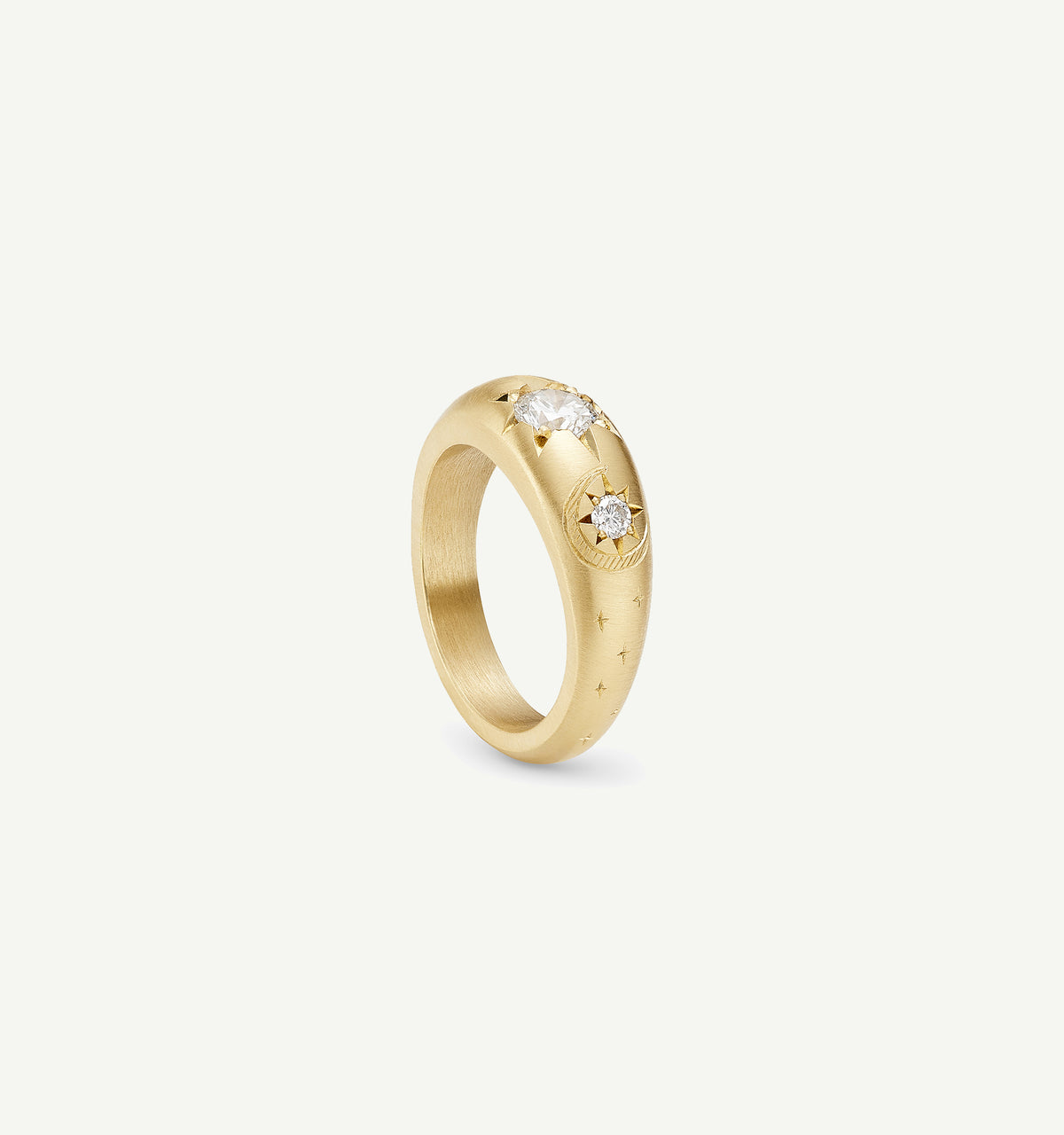 Gold ring featuring two diamonds and engraved star motifs.