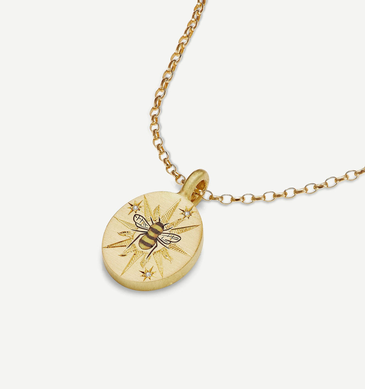 Gold pendant necklace featuring an engraved bee and star motif on a gold chain.