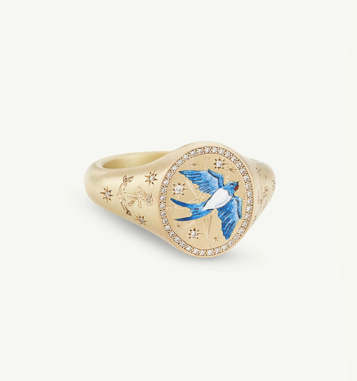 Gold ring featuring an enamel blue bird design and small white diamonds surrounding the central motif.