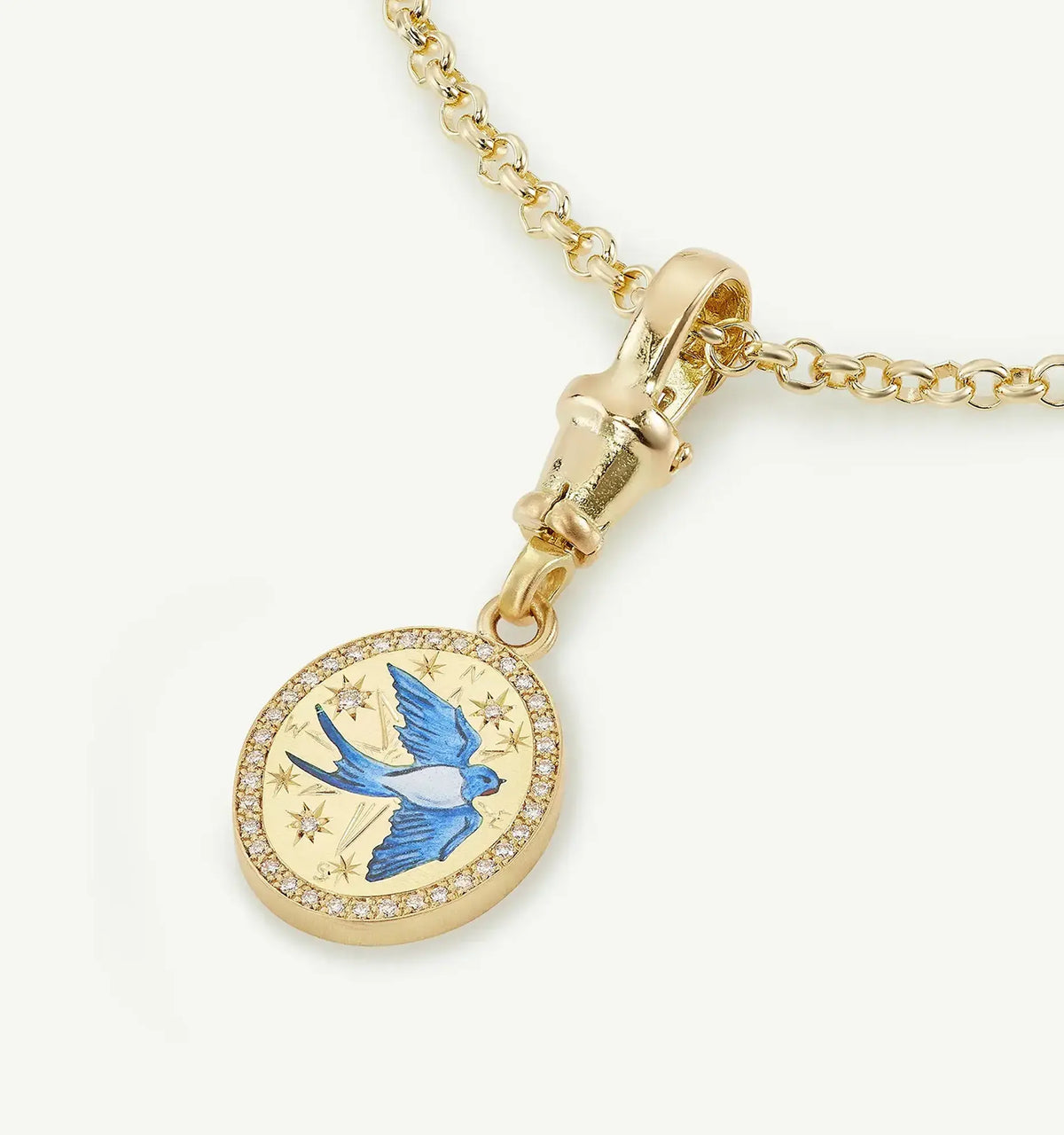 Gold pendant with blue bird enamel design surrounded by diamonds.
