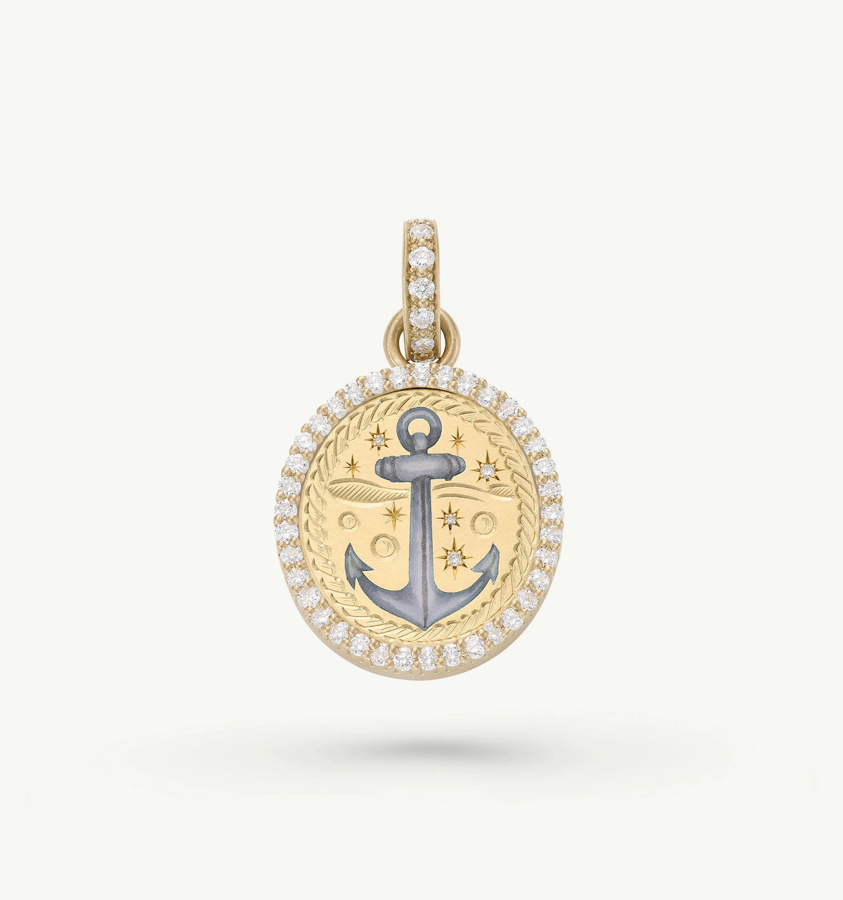 Gold pendant featuring an anchor design with enamel accents, surrounded by a halo of small diamonds.