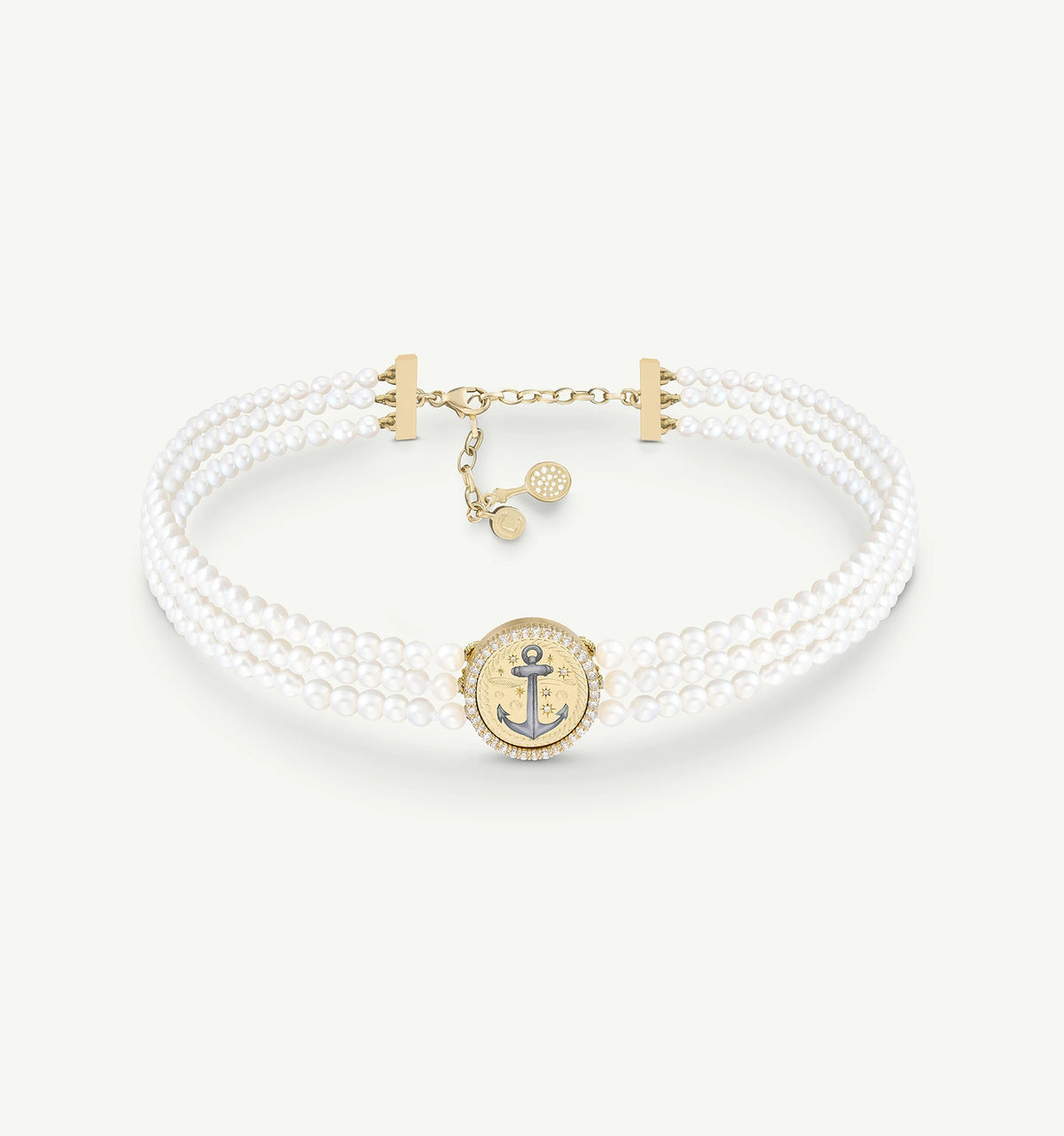 Gold choker featuring a round anchor motif encased in gold, adorned with white pearls and a delicate clasp.