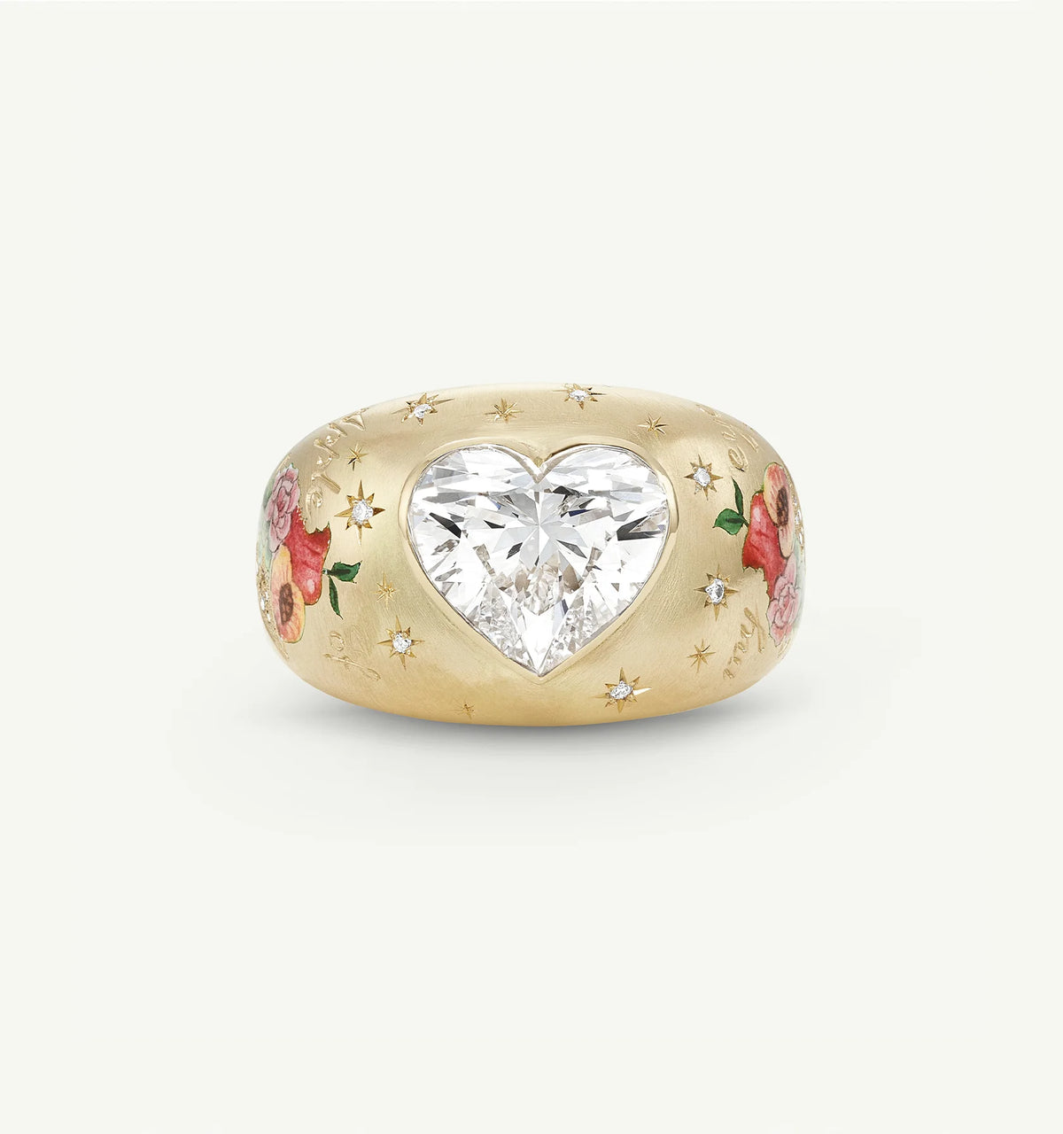 Gold ring featuring a heart-shaped diamond centre and floral enamel motifs.
