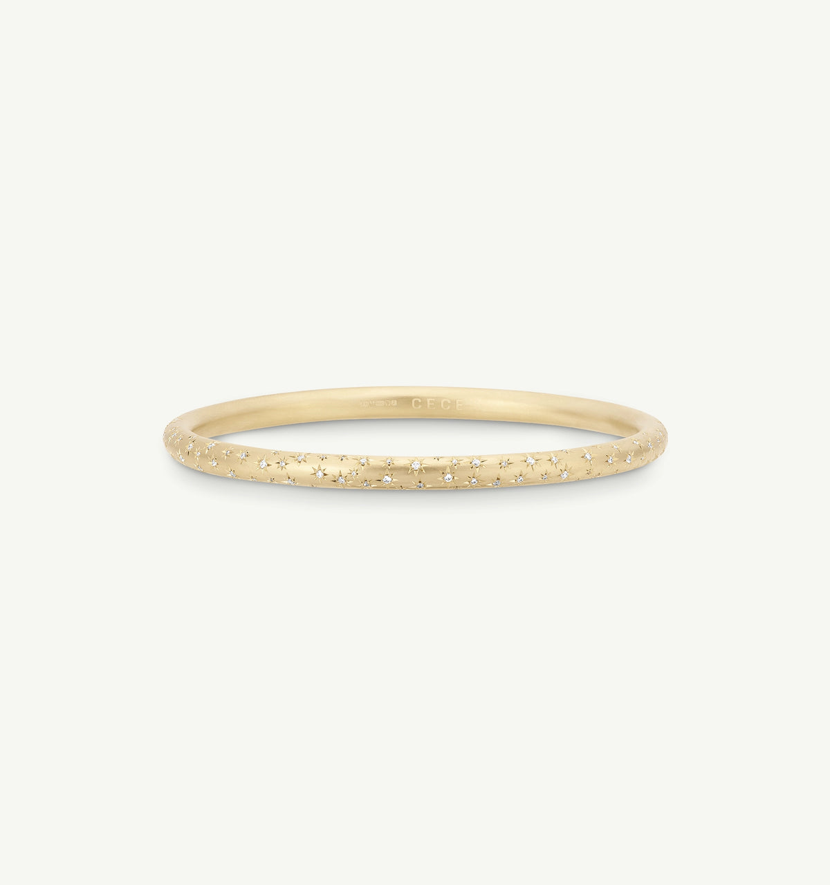 Gold ring featuring star motifs along the band.