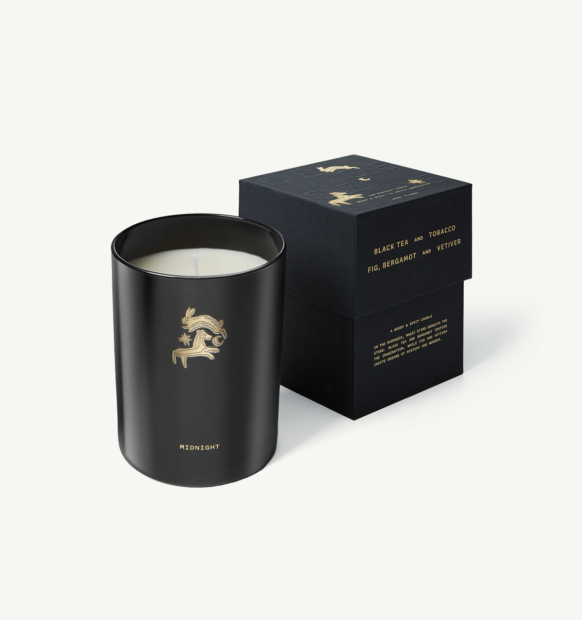 Black candle with a gold illustration, encased in a matte black container, accompanied by a decorative black box.