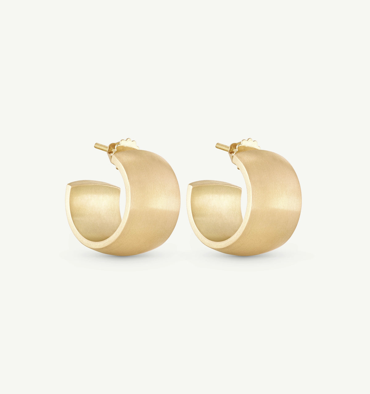 Gold hoop earrings with a brushed finish and a minimalist design.