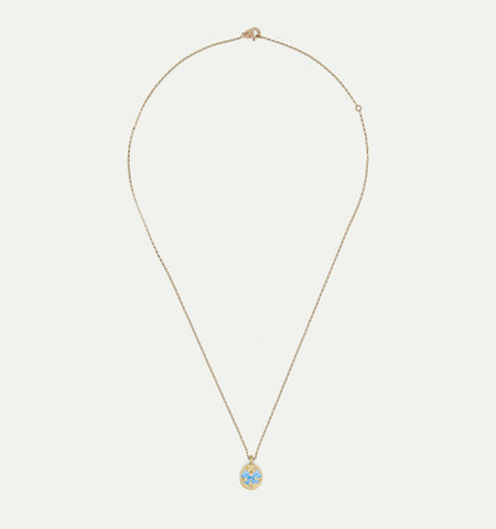 Gold necklace featuring an engraved pendant with blue enamel accents.