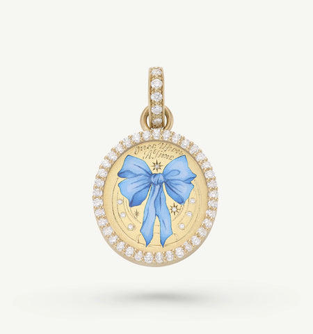 Gold pendant featuring a blue bow design in enamel, surrounded by a halo of diamonds.