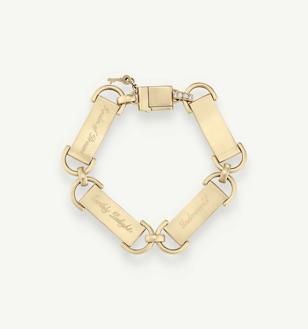 Gold bracelet featuring engraved rectangular links and a clasp with a small decorative element.
