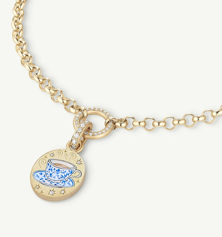 Gold chain necklace featuring a pendant with a blue teacup design and diamond accents.