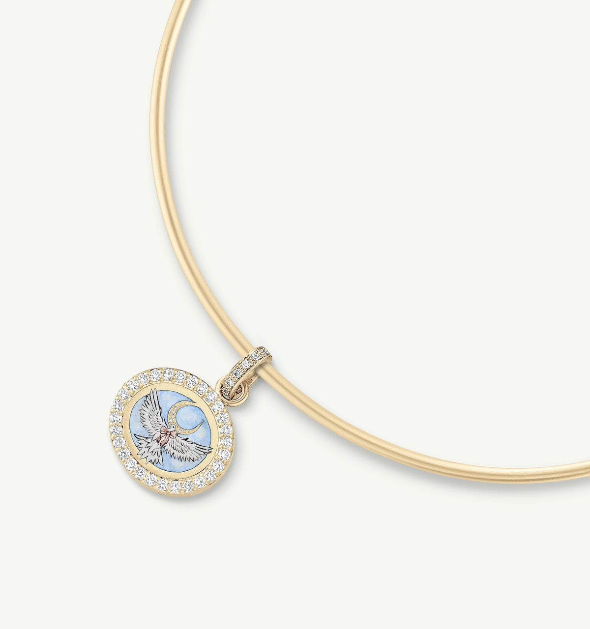 Gold pendant featuring an embossed bird motif with blue enamel and surrounded by a halo of diamonds.