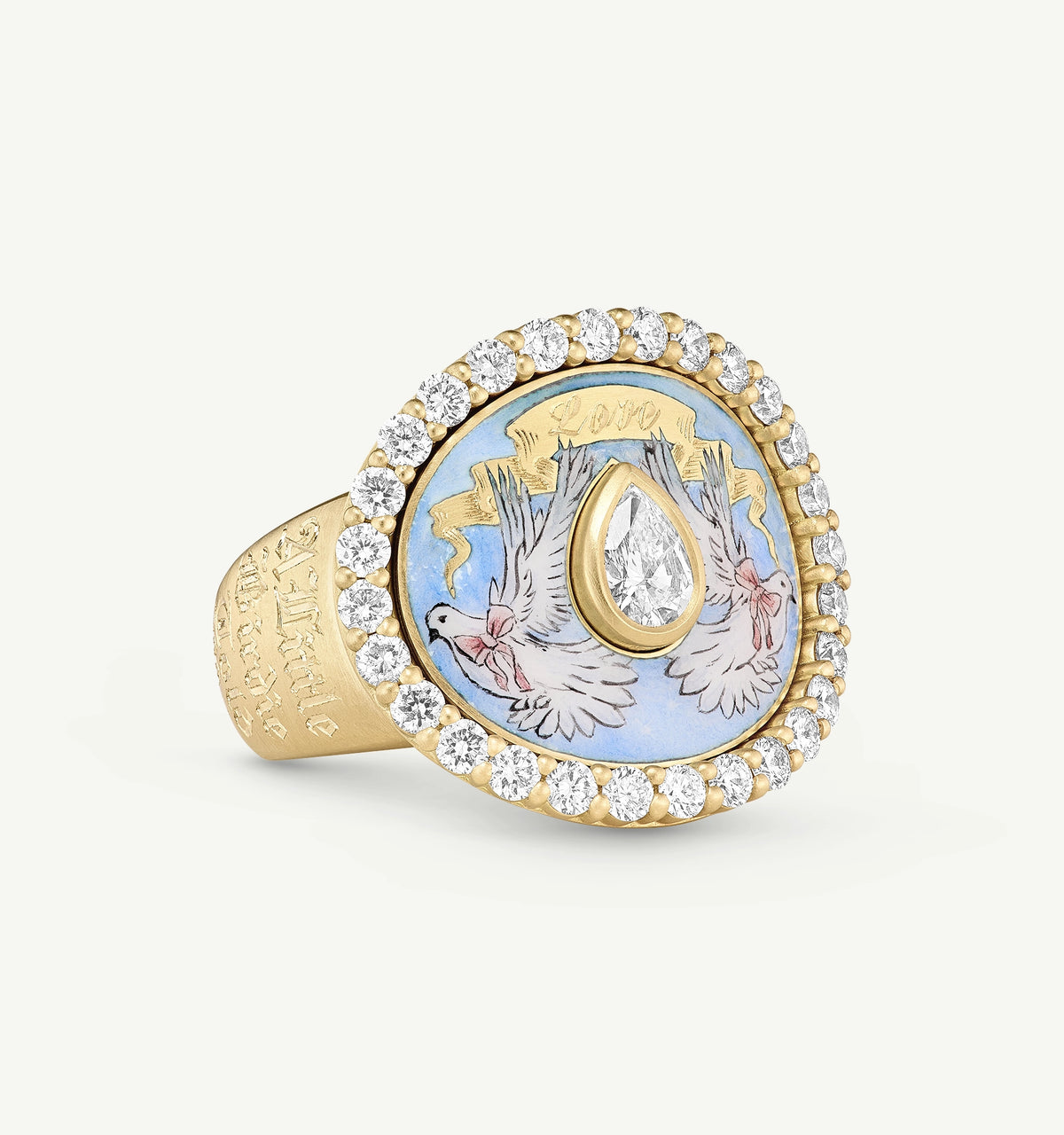 Gold ring featuring a blue enamel inlay with two doves and a pear-shaped diamond surrounded by diamonds.