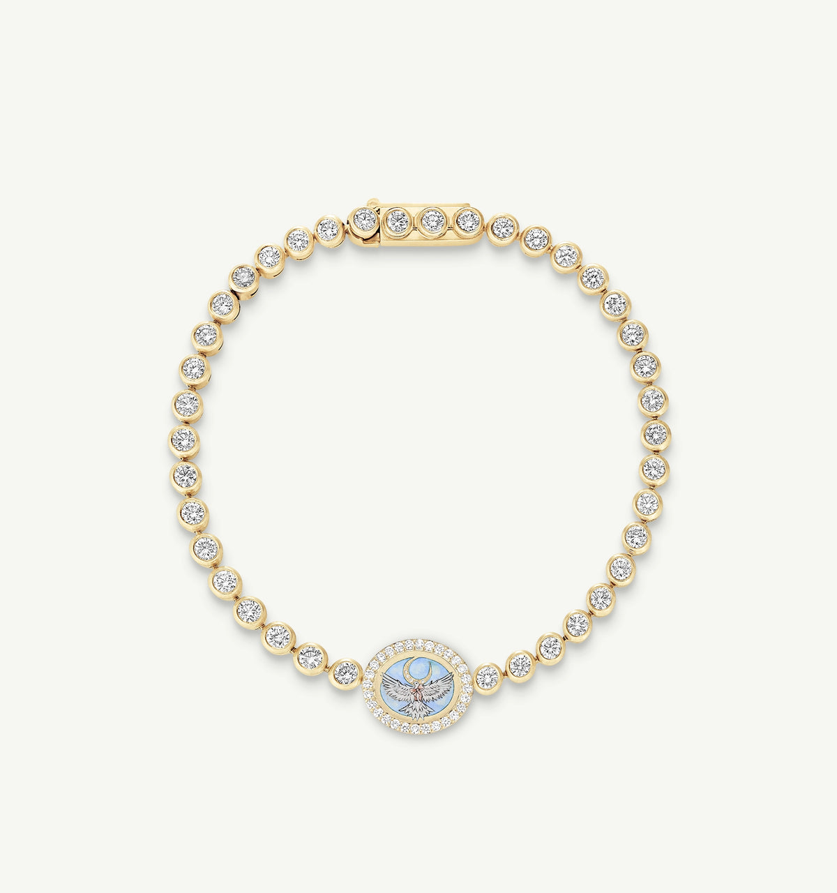 Gold bracelet featuring an engraved design and round diamonds set along the band.