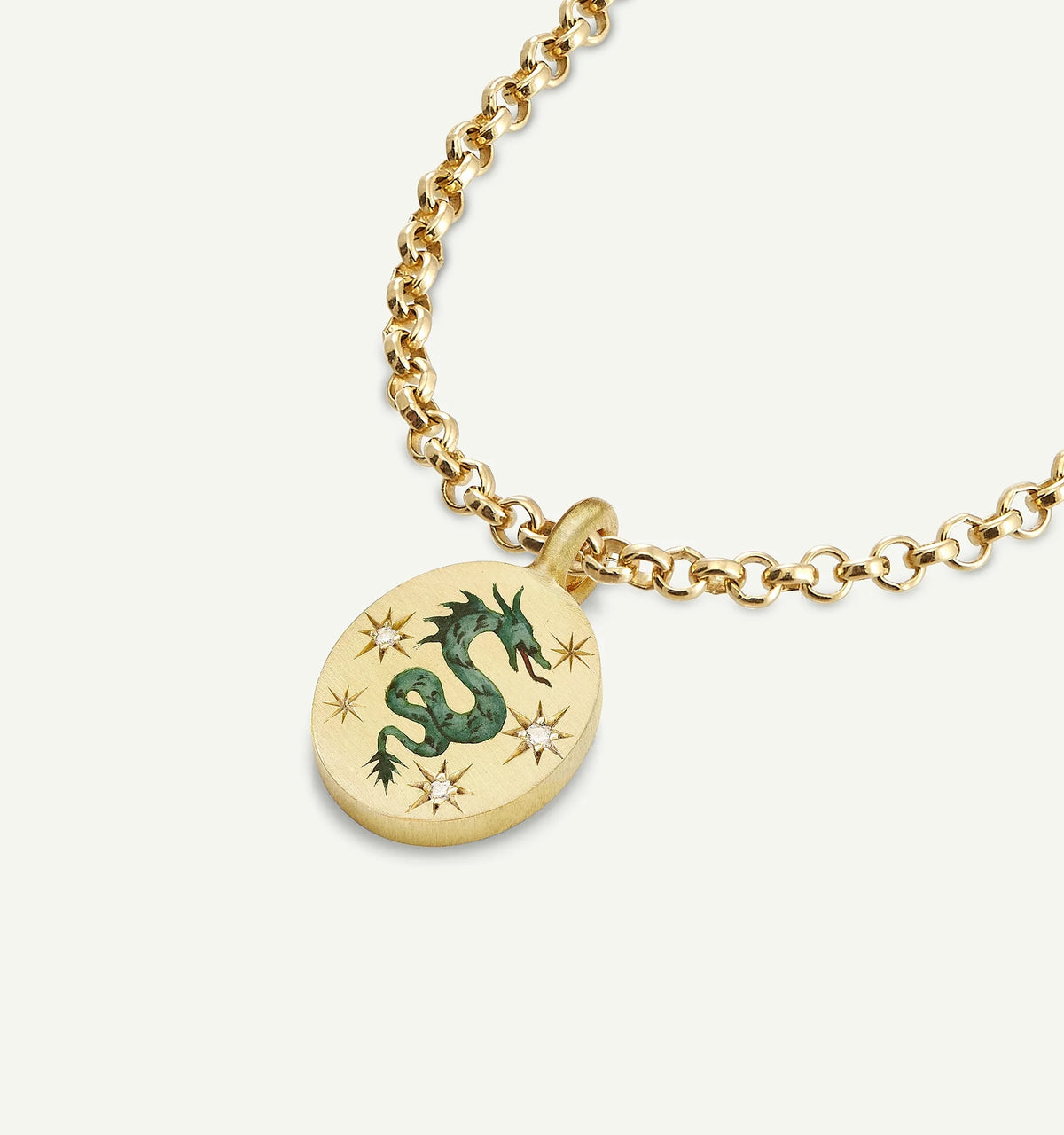 Gold necklace featuring an oval pendant with a dragon motif in enamel and star accents made with diamonds.