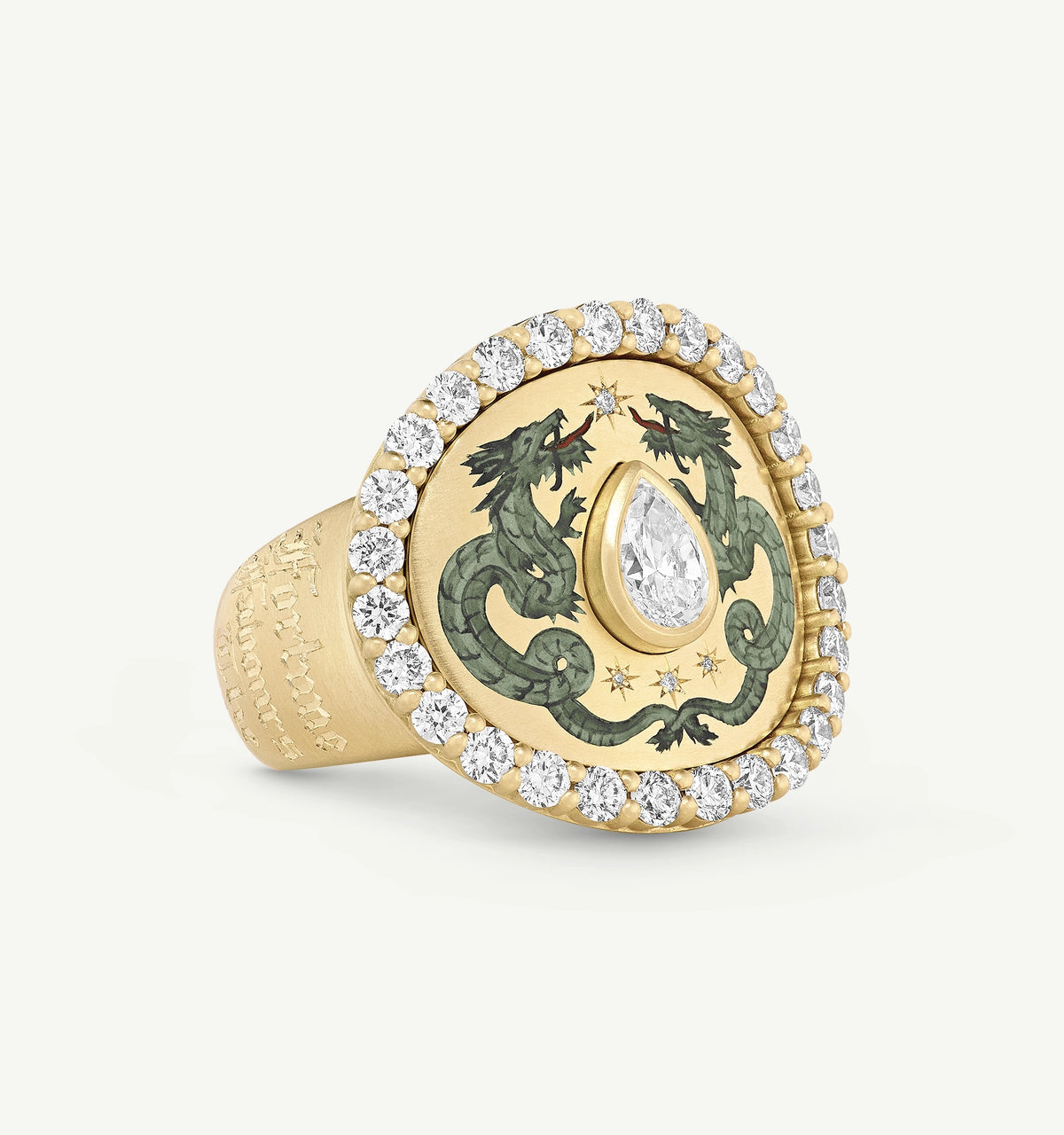Gold ring featuring a teardrop diamond surrounded by emerald dragons and a halo of diamonds.