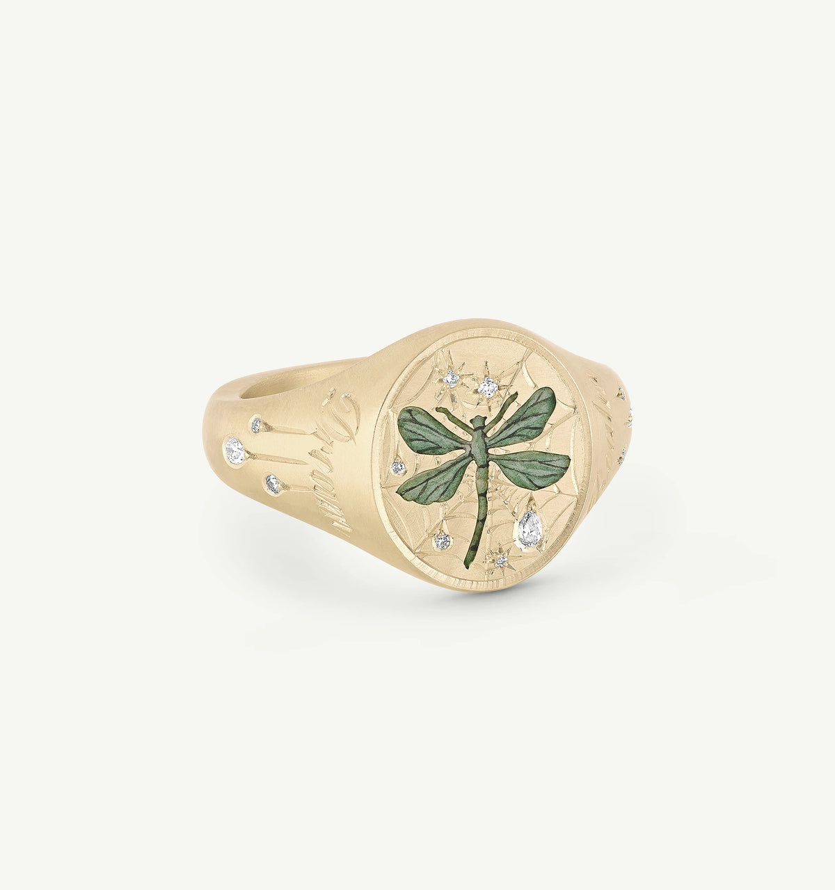 Gold ring featuring a green dragonfly with diamond accents and engraved details.