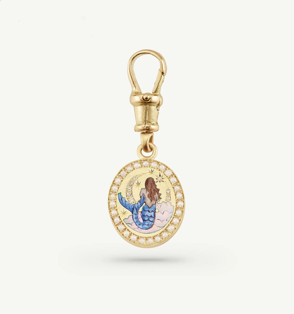 Gold charm featuring a mermaid illustration with a colourful enamel design and a border of white pearls.