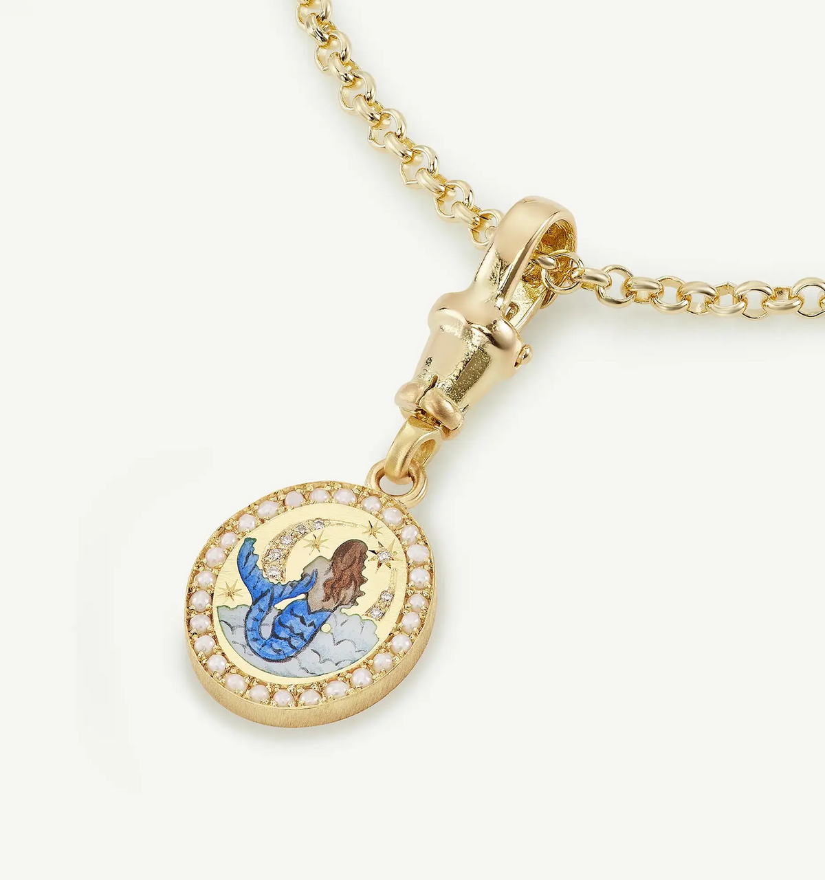 Gold pendant featuring a mermaid design in enamel, surrounded by a ring of gold accents.