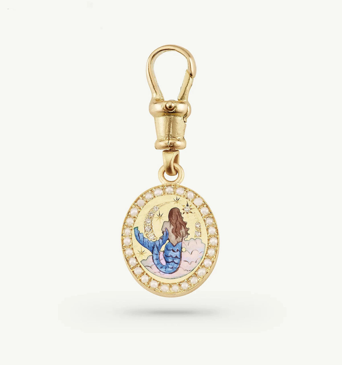 Gold charm depicting a mermaid with a painted enamel design, surrounded by a circular pearl frame.