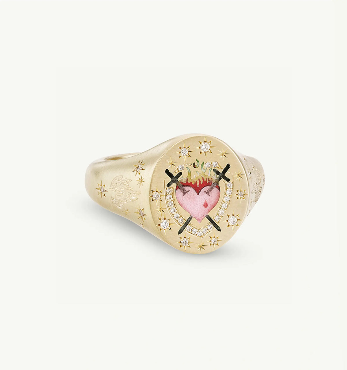Gold signet ring featuring an enamel heart design with crossed swords and diamonds surrounding it.