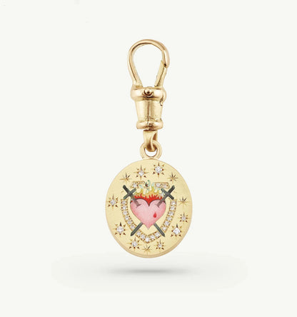 Gold charm featuring a heart design, crossed swords, and small diamonds set in a star pattern.