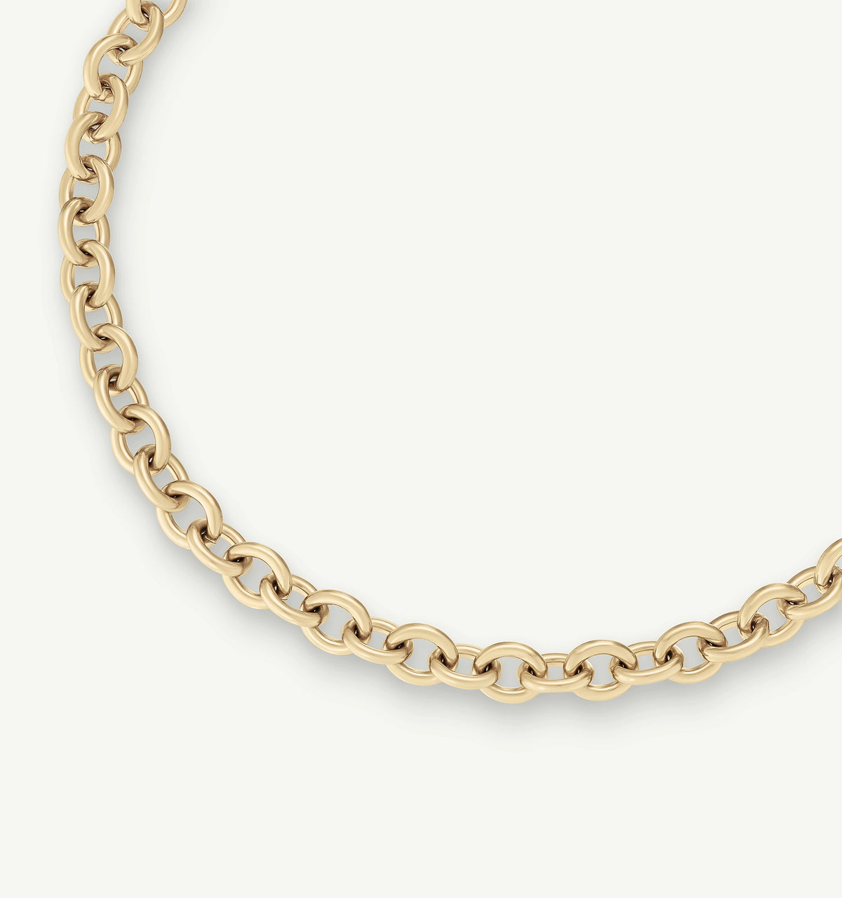 Gold chain necklace with interlocking oval links on a light background.