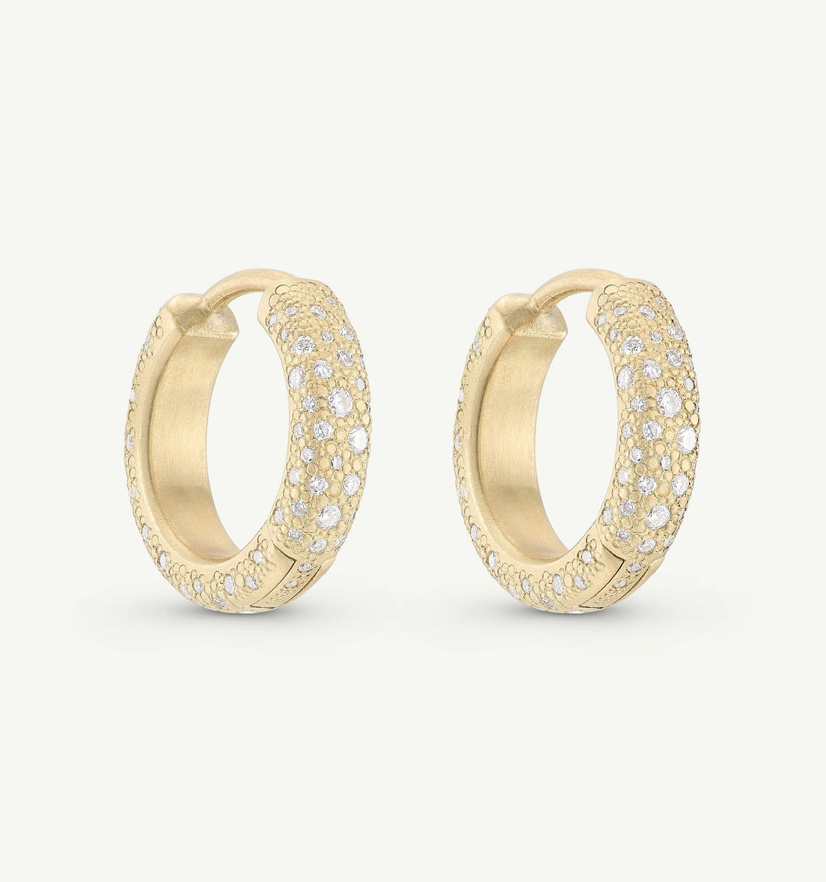 Gold hoop earrings adorned with multiple diamonds arranged in a textured pattern.