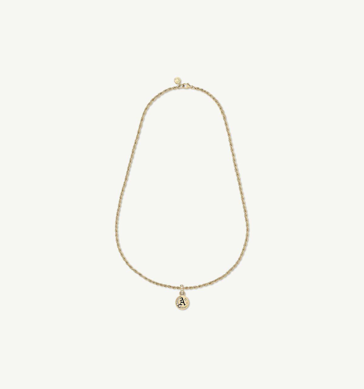 Gold necklace featuring an engraved pendant with the letter "A".