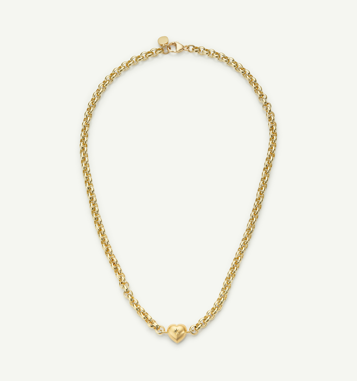 Gold necklace featuring a heart pendant on a chain.